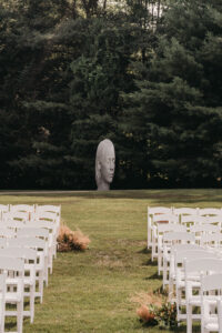 Empty ceremony chairs in field